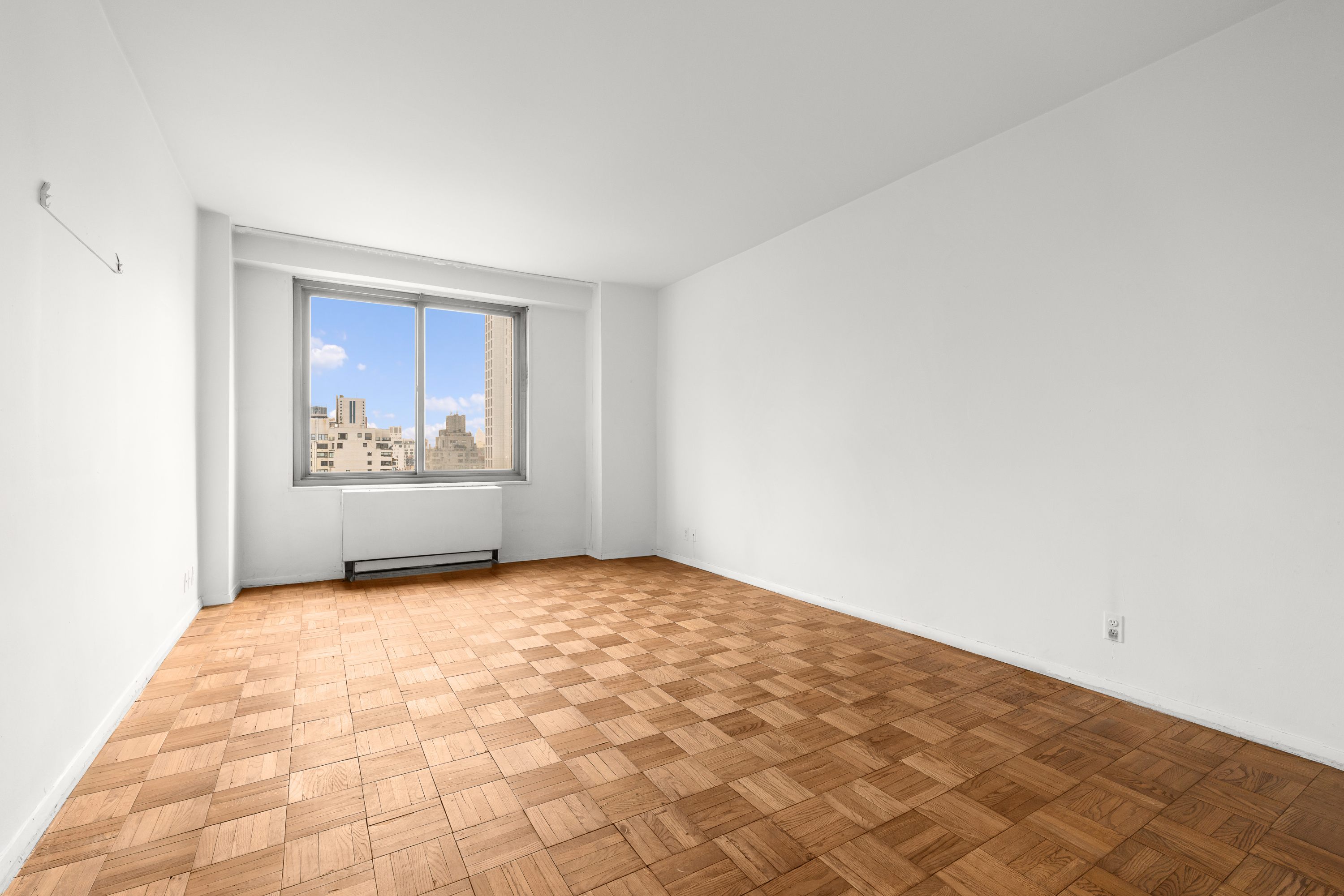 300 East 74th Street, Unit 20E Manhattan, NY 10021 - Photo 5 of 14 an empty room with windows
