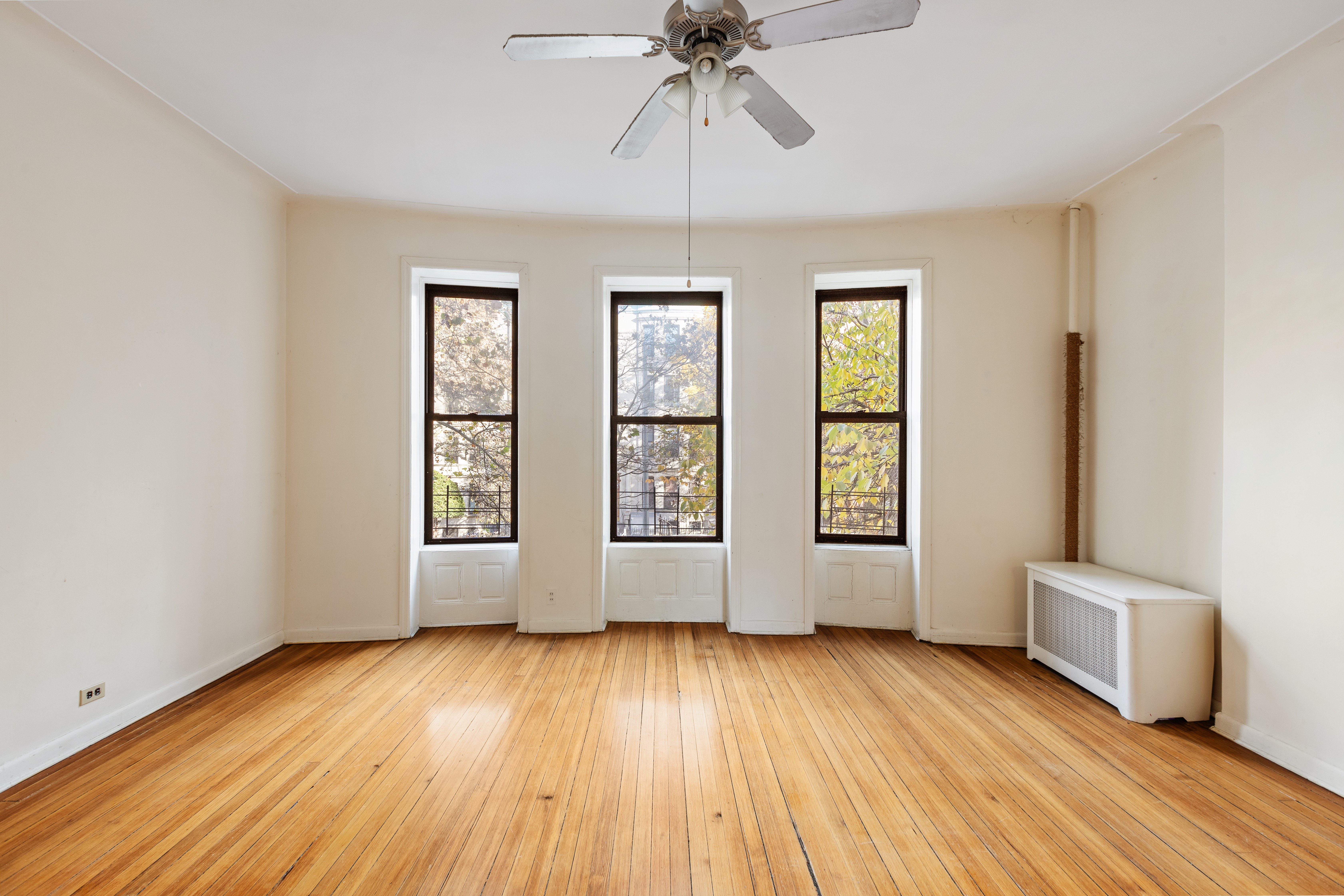 474 3rd Street, Unit 2L Brooklyn, NY 11215 - Photo 2 of 11 a view of an empty room with a window and wooden floor