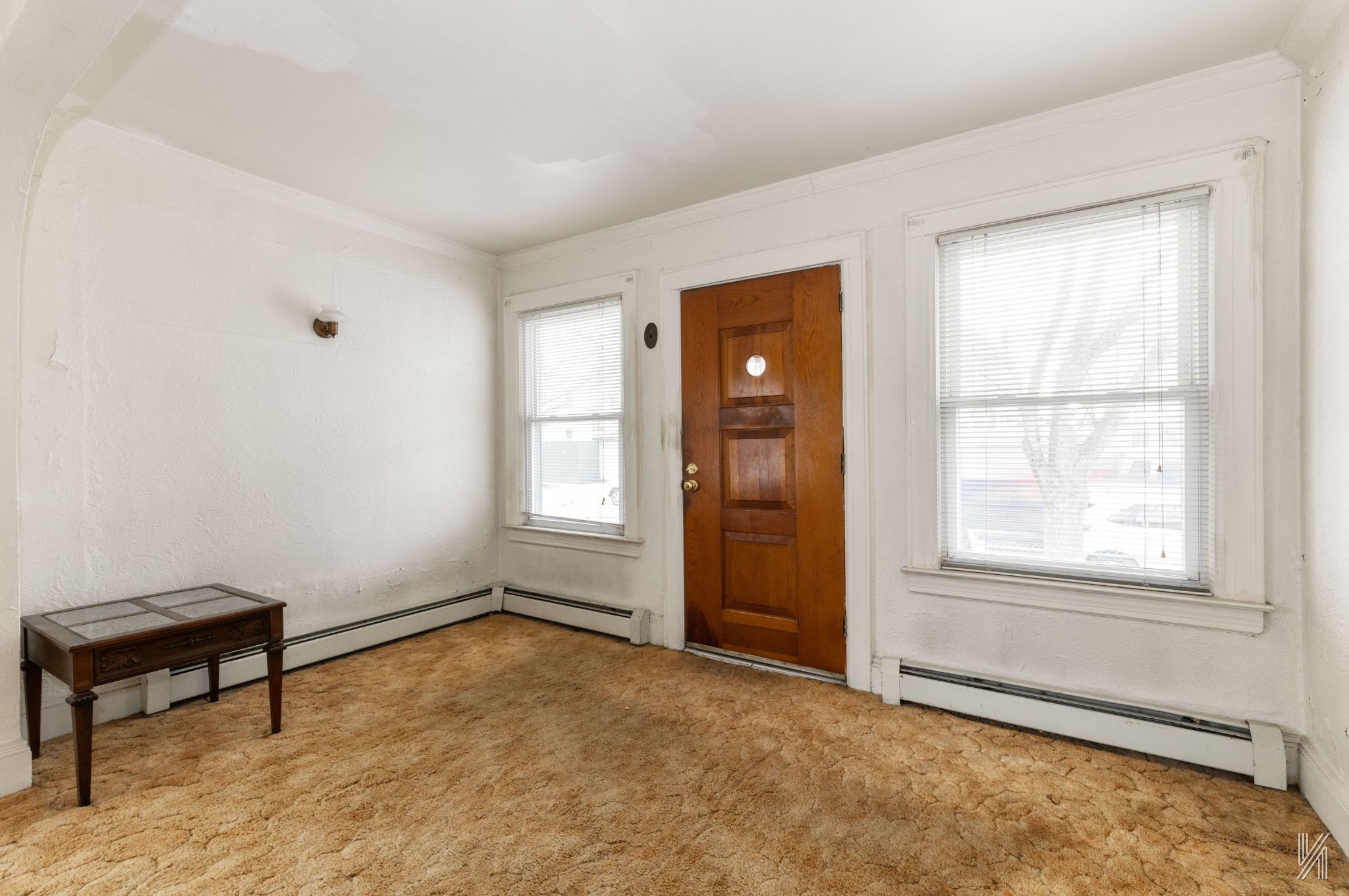 135-16 95th Street Queens, NY 11417 - Photo 7 of 21 an empty room with windows and closet