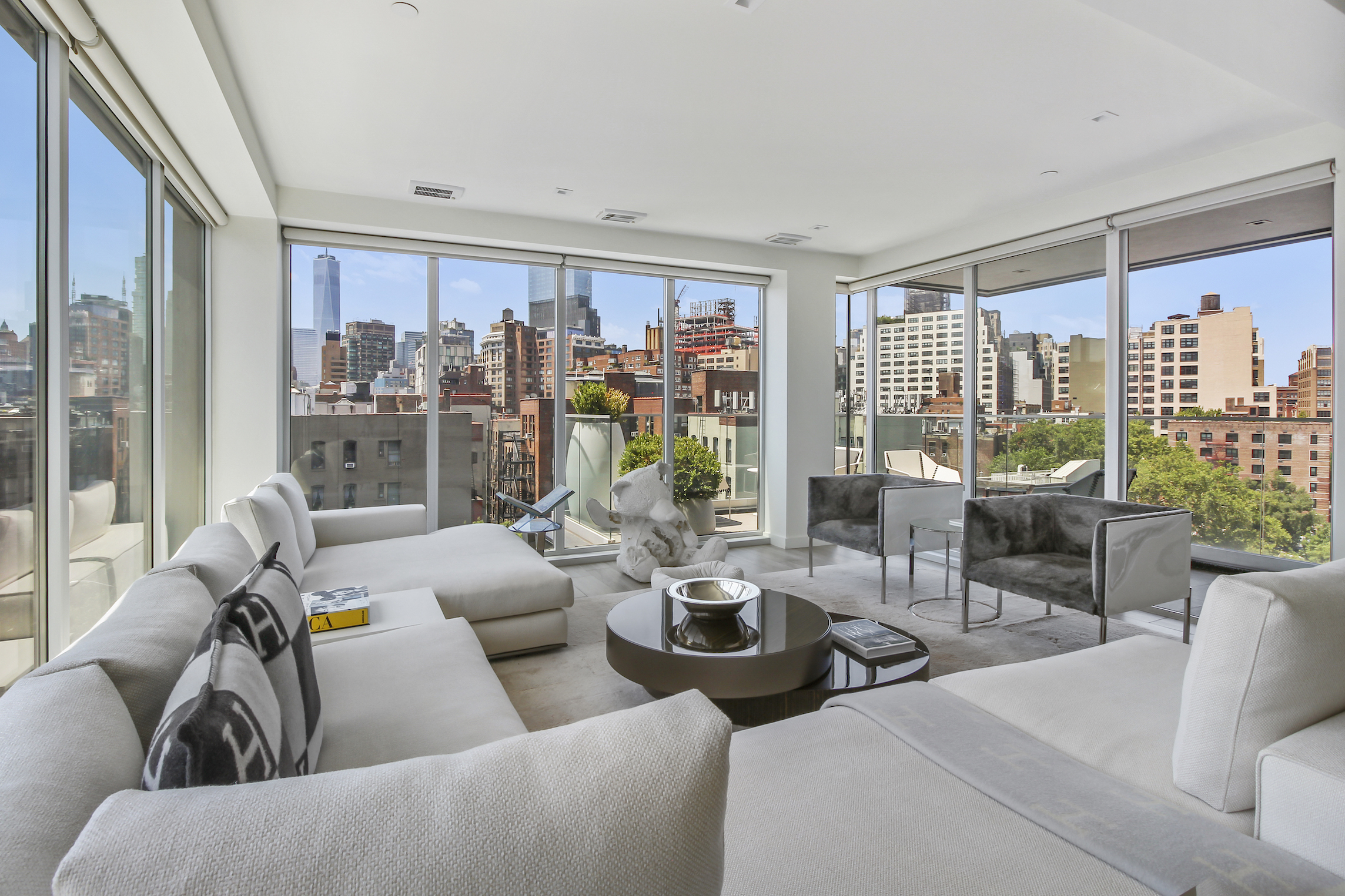 136 West Houston Street, Unit PH Manhattan, NY 10012 - Photo 3 of 26 a living room with furniture and a large window