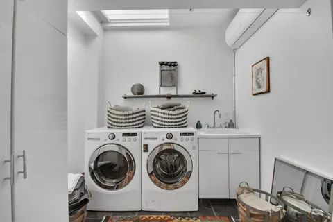 a view of livingroom with washer and dryer