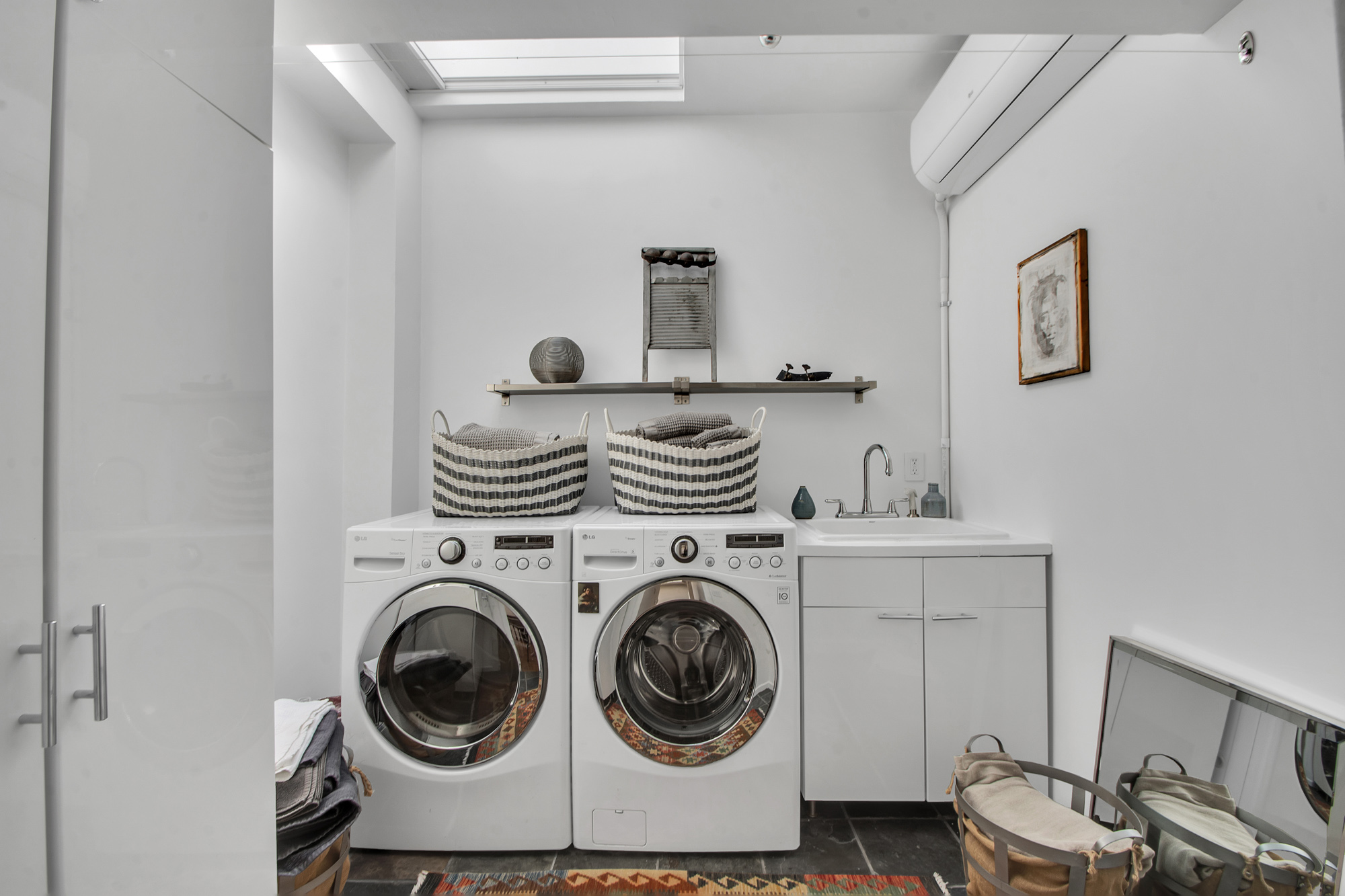 383 Grand Avenue Brooklyn, NY 11238 - Photo 23 of 32 a view of livingroom with washer and dryer