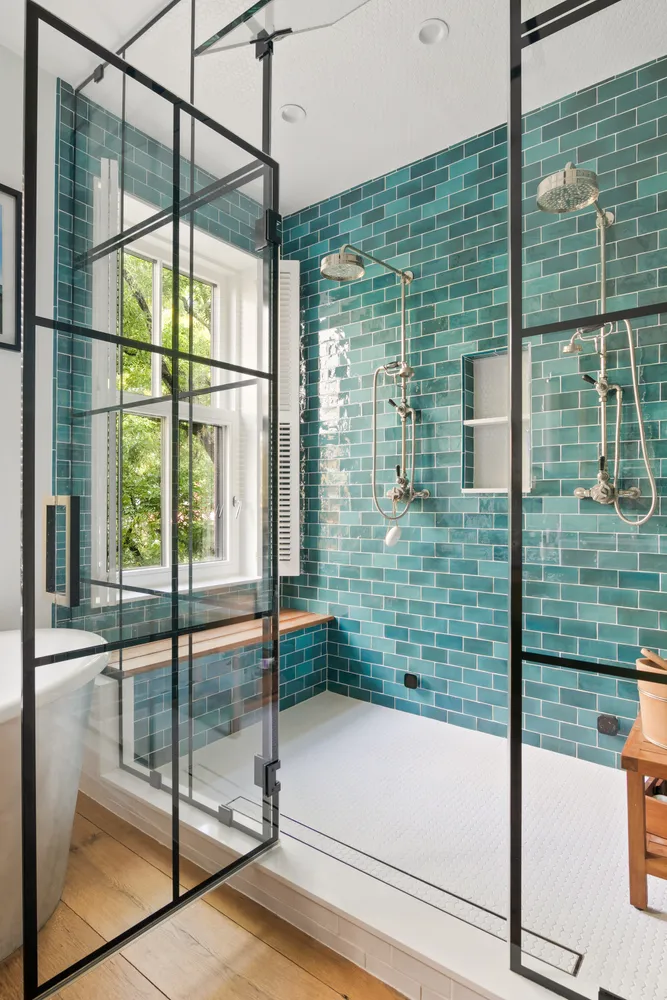 a bathroom with a glass shower door