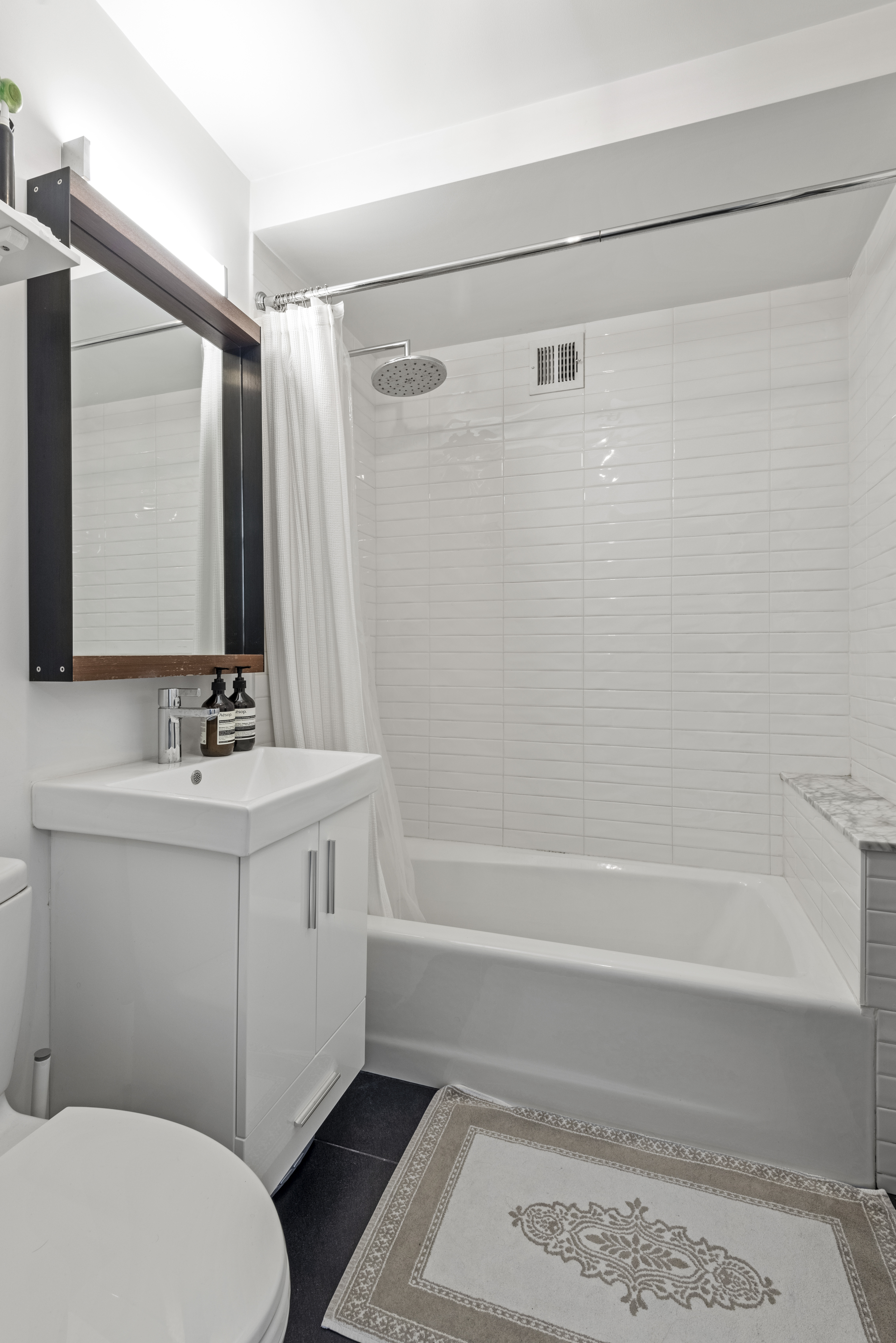 347 3rd Street, Unit C4A Brooklyn, NY 11215 - Photo 8 of 11 a bathroom with a sink a toilet and shower