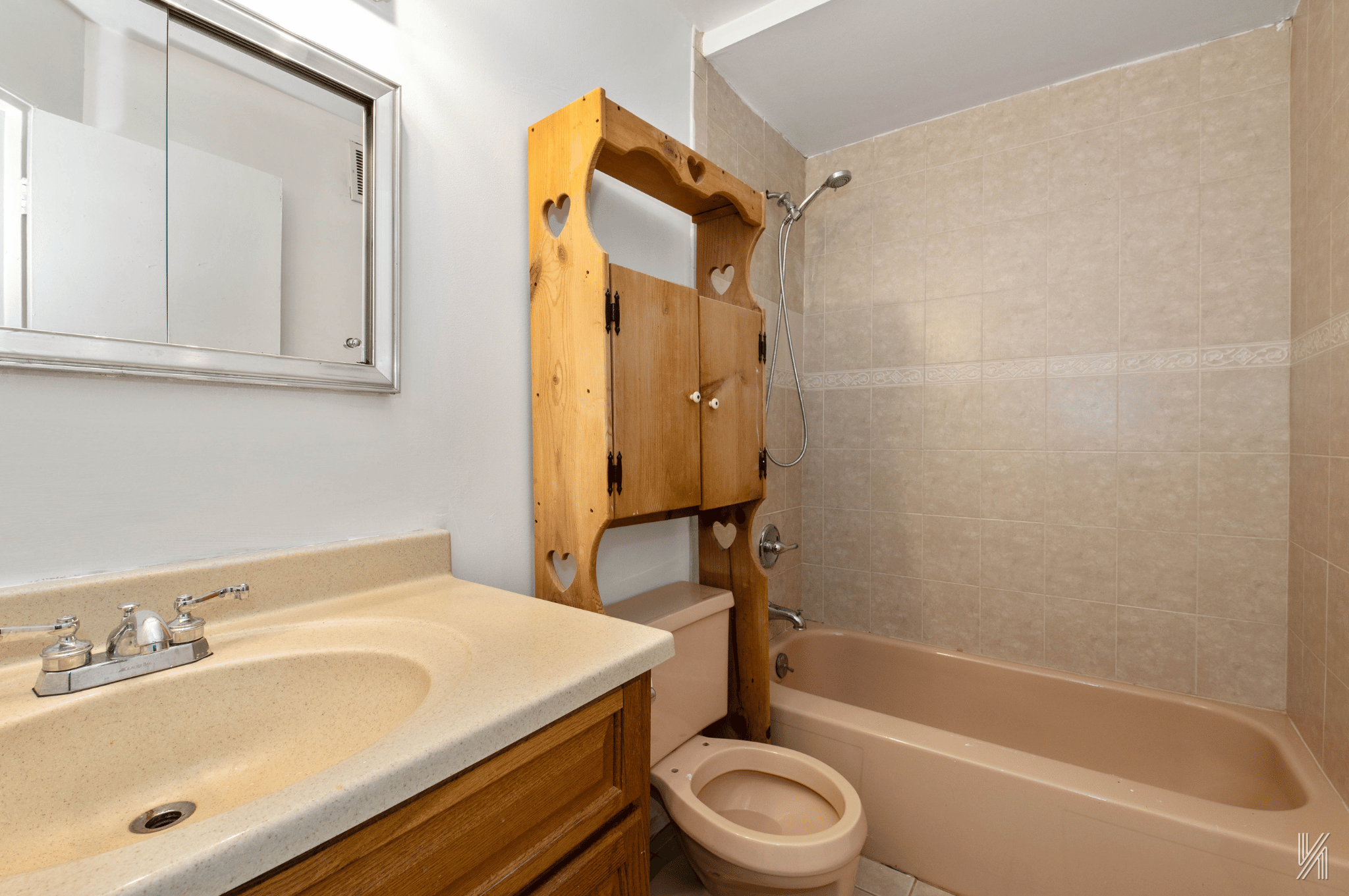 1148 East 73rd Street Brooklyn, NY 11234 - Photo 9 of 15 a bathroom with a sink toilet and shower