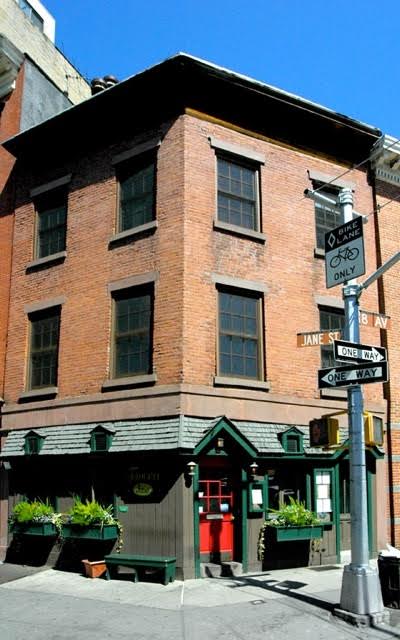 31 8th Avenue, Unit 1 Manhattan, NY 10014 - Photo 9 of 10 a front view of a building with retail street