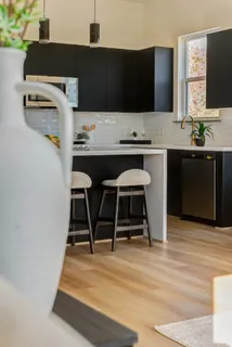 a kitchen with a table and chairs in it