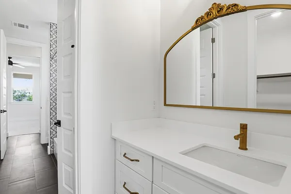 a bathroom with a sink and a mirror