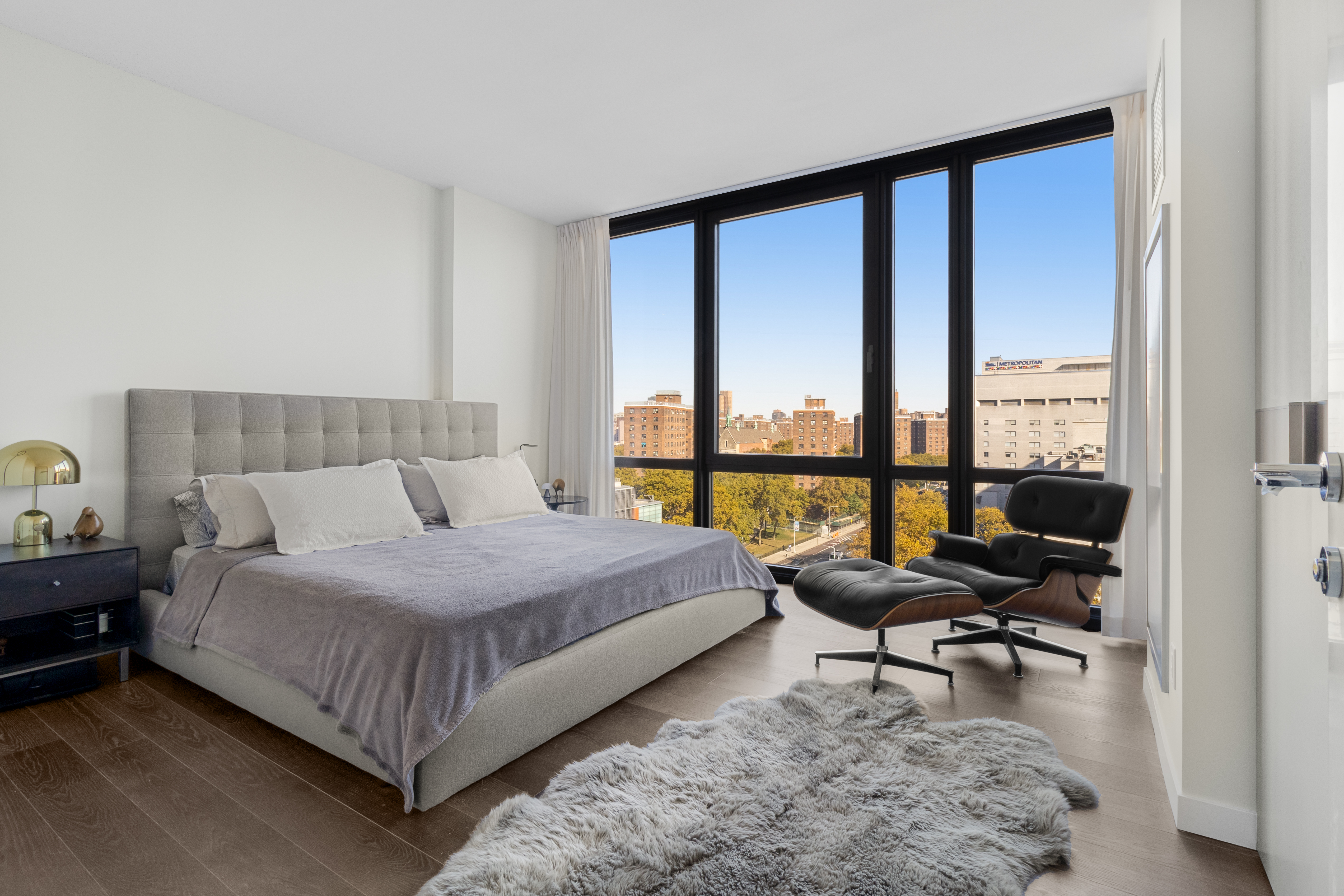 302 East 96th Street, Unit 1103 Manhattan, NY 10128 - Photo 6 of 22 a bedroom with a bed and a window