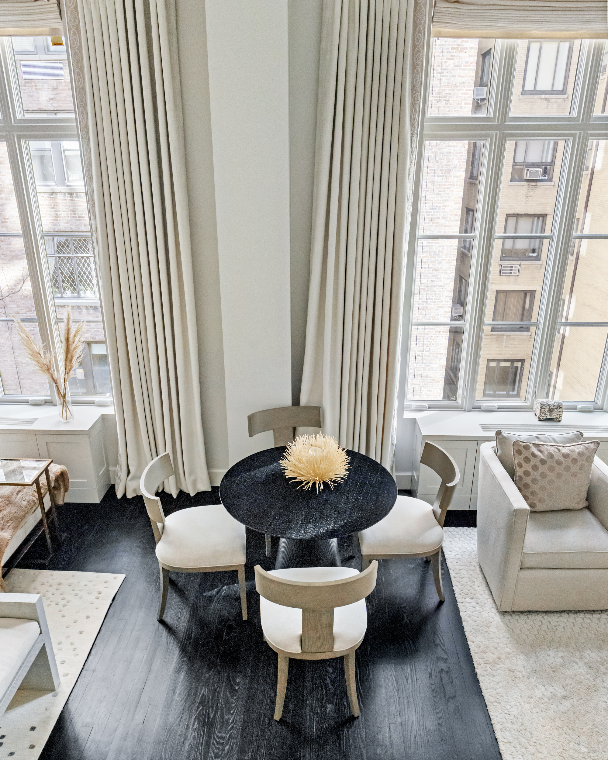 169 East 78th Street, Unit 7C Manhattan, NY 10075 - Photo 25 of 30 a living room with furniture and a window