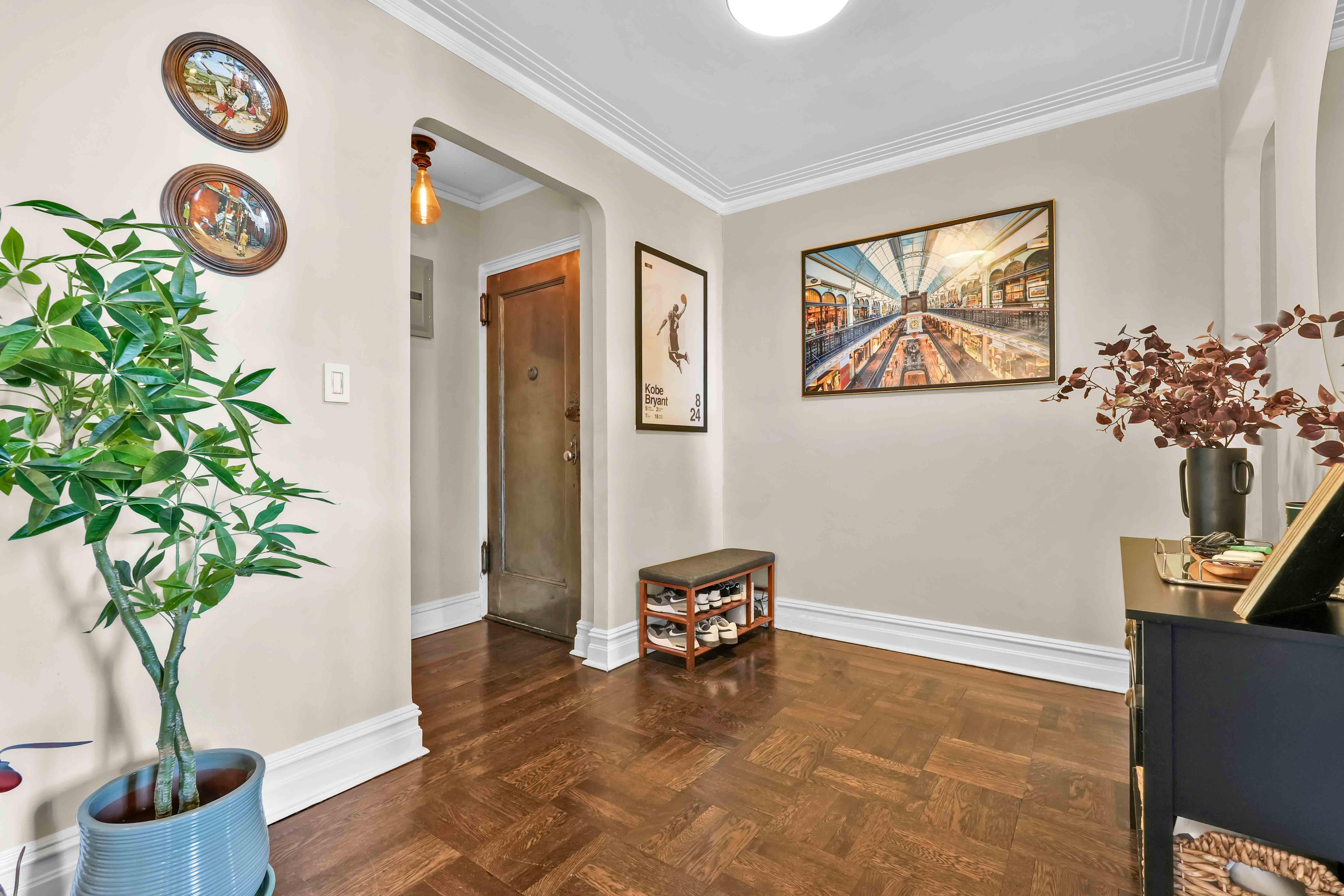 255 West 23rd Street, Unit 5GW Manhattan, NY 10011 - Photo 13 of 35 a living room with furniture and a potted plant