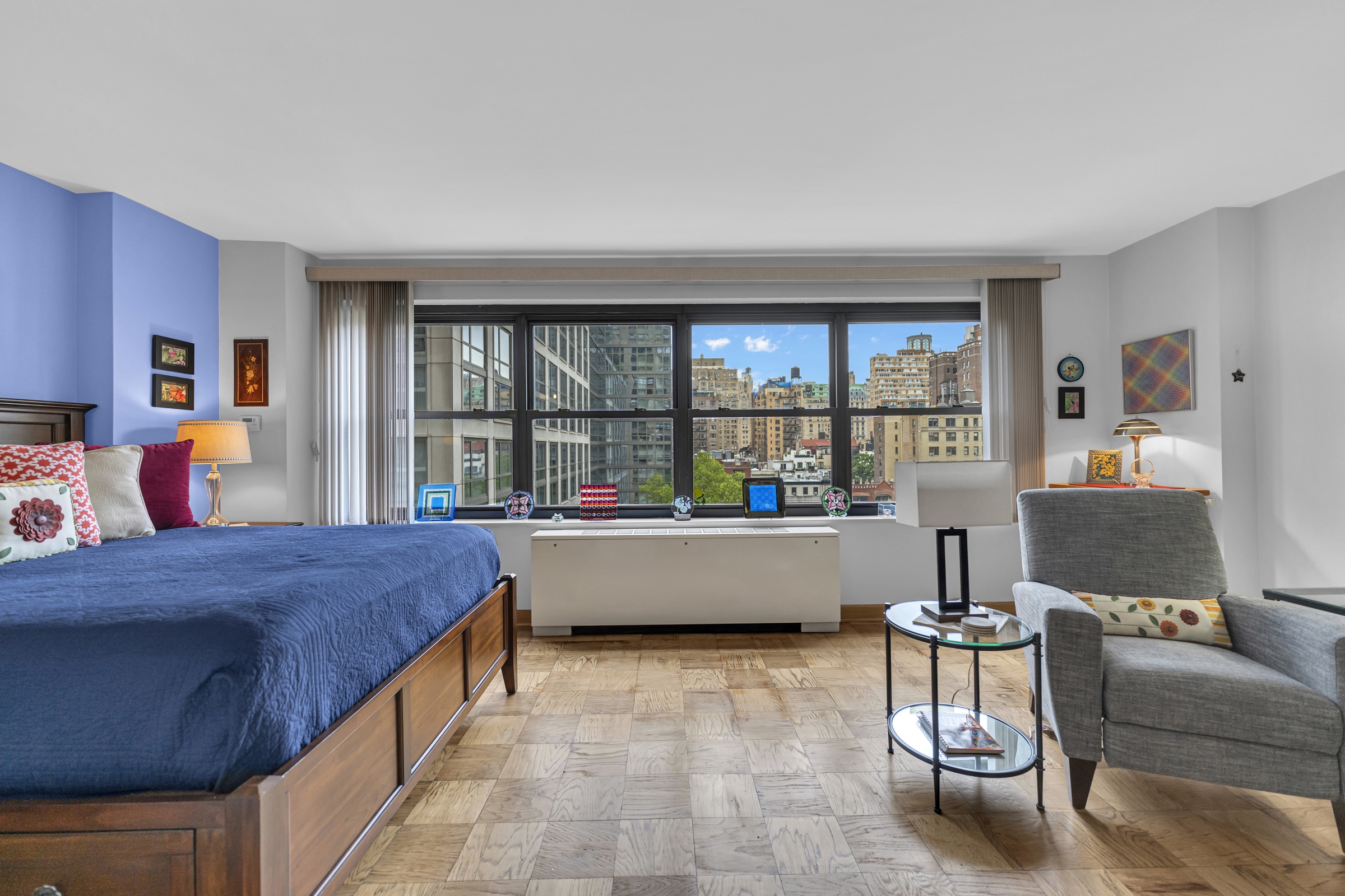 180 West End Avenue, Unit 9P Manhattan, NY 10023 - Photo 3 of 13 a living room with furniture and a large window