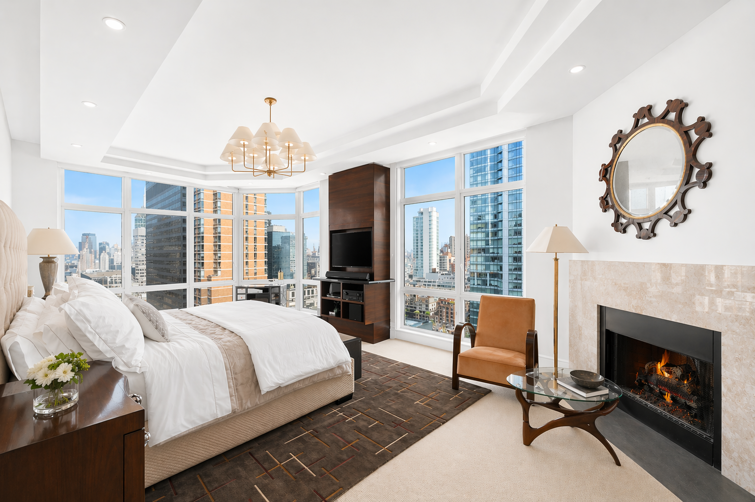 300 East 55th Street, Unit PHC Manhattan, NY 10022 - Photo 14 of 23 a bedroom with a bed a table chair and a fireplace