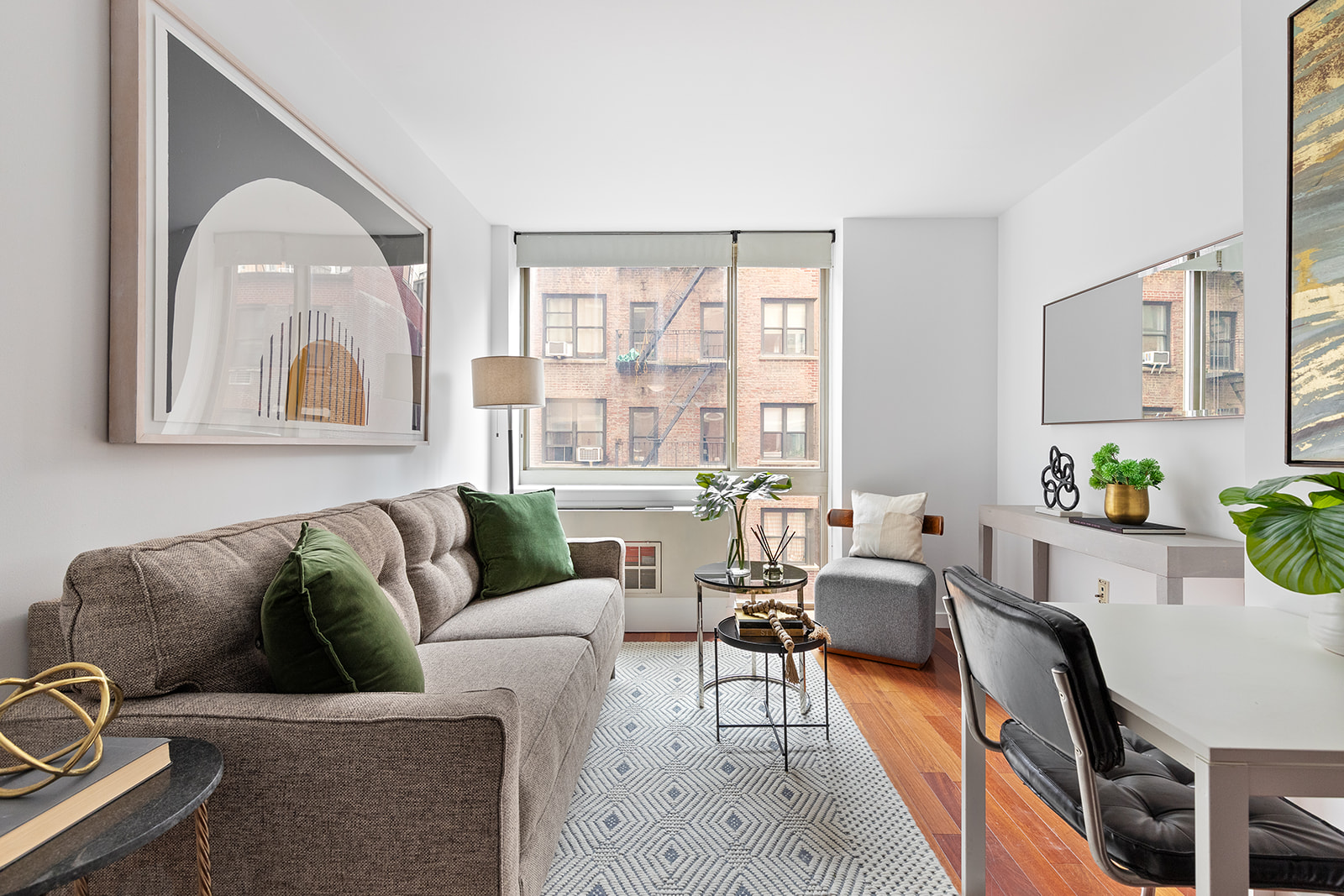 121 East 23rd Street, Unit 4H Manhattan, NY 10010 - Photo 3 of 12 a living room with furniture and a large window