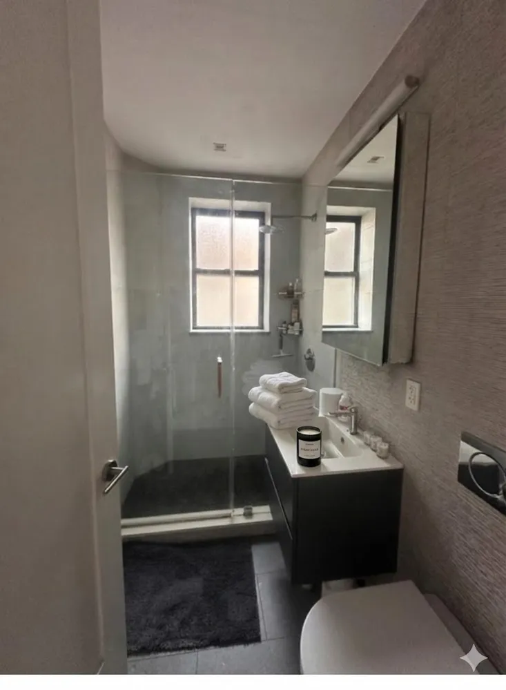 a bathroom with a sink a toilet and tub