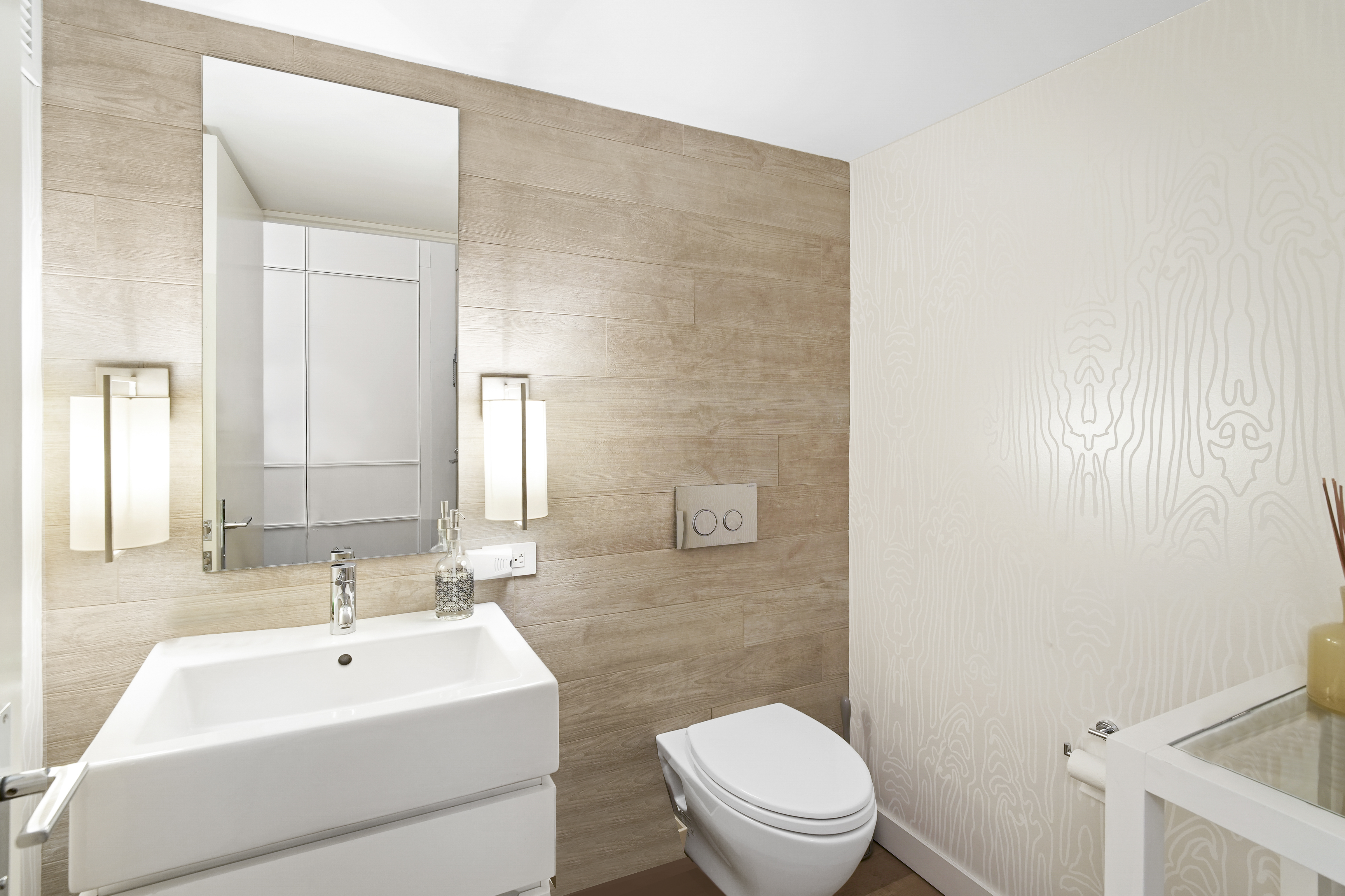 421 Hudson Street, Unit 221 Manhattan, NY 10014 - Photo 18 of 21 a bathroom with a sink a toilet and shower