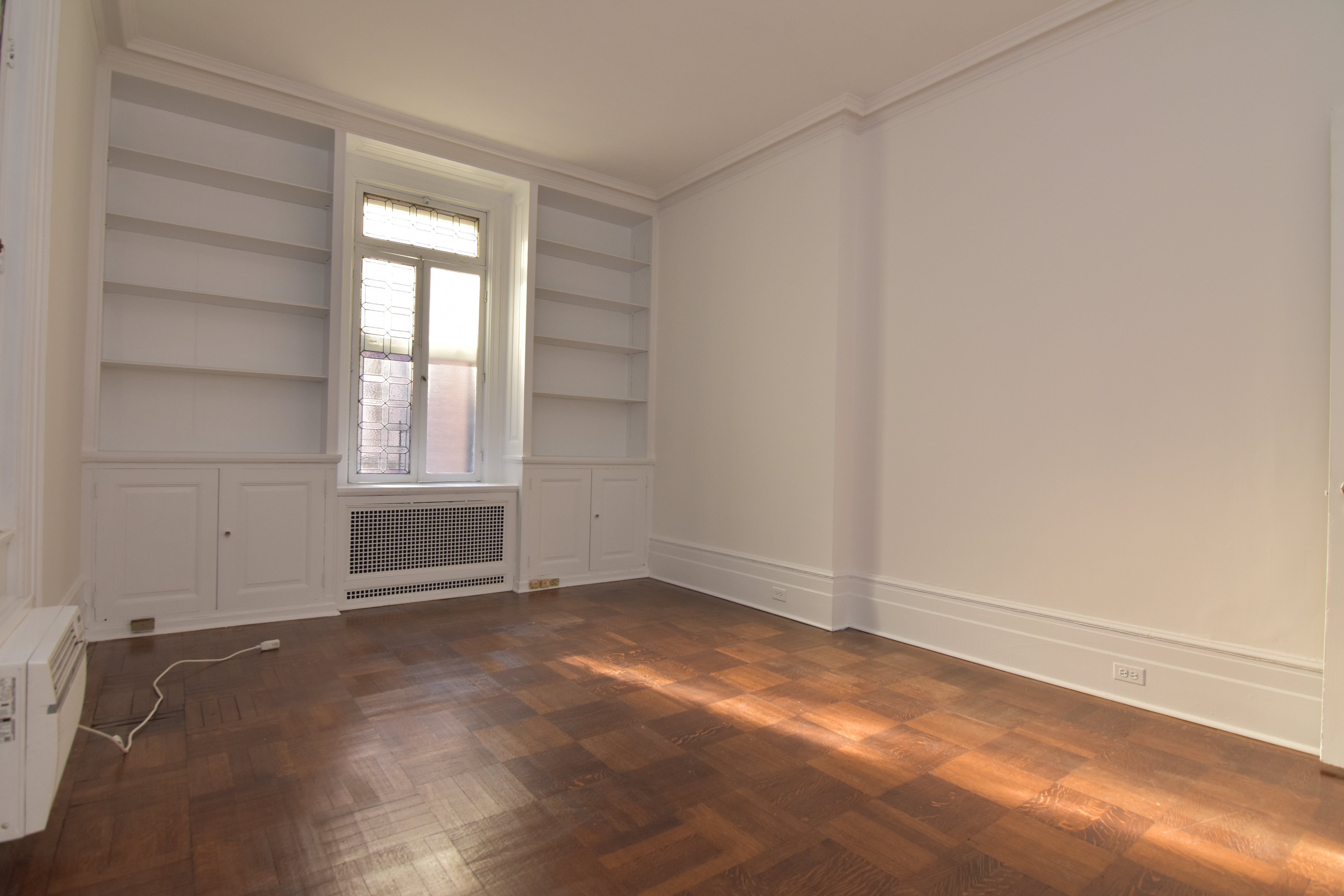 18 East 67th Street, Unit 2B/3B Manhattan, NY 10065 - Photo 11 of 18 an empty room with windows