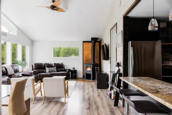 a living room with furniture and wooden floor