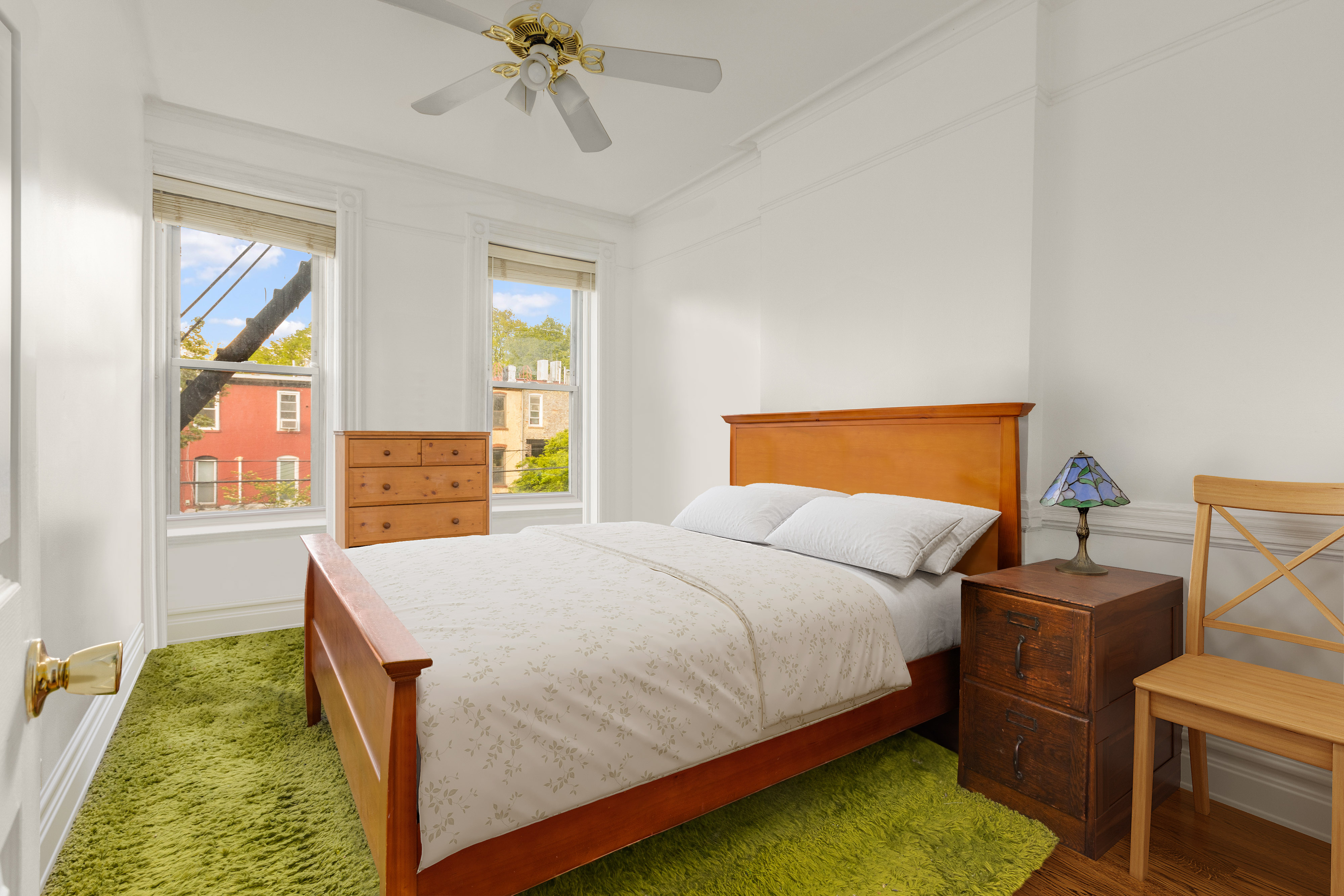 449 11th Street Brooklyn, NY 11215 - Photo 7 of 17 a bedroom with a bed and window