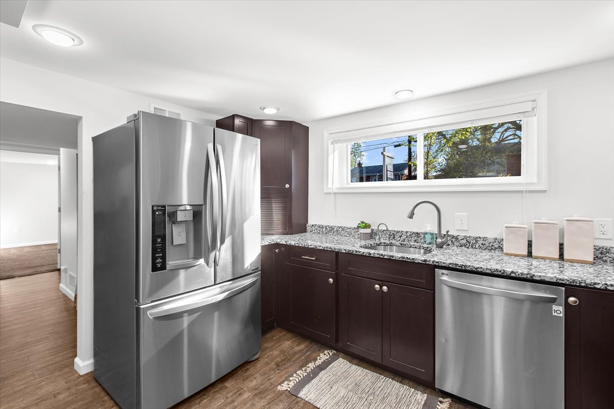 12712 Atherton Drive Silver Spring, MD 20906 - Photo 22 of 40 a kitchen with stainless steel appliances granite countertop a refrigerator and a sink