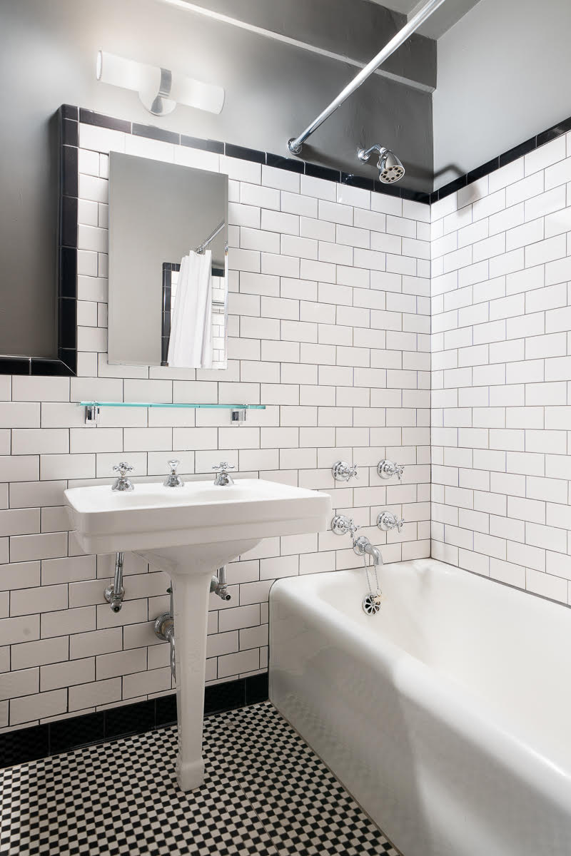 433 West 34th Street, Unit 9E Manhattan, NY 10001 - Photo 5 of 10 a bathroom with a sink and a bathtub