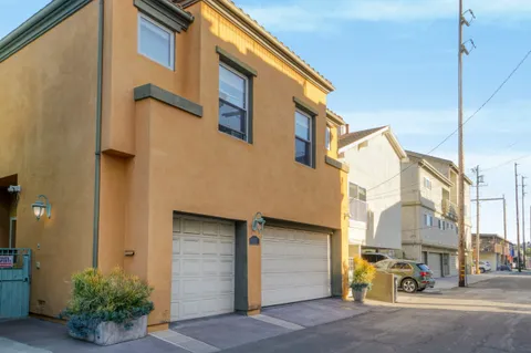 a front view of a house with garage