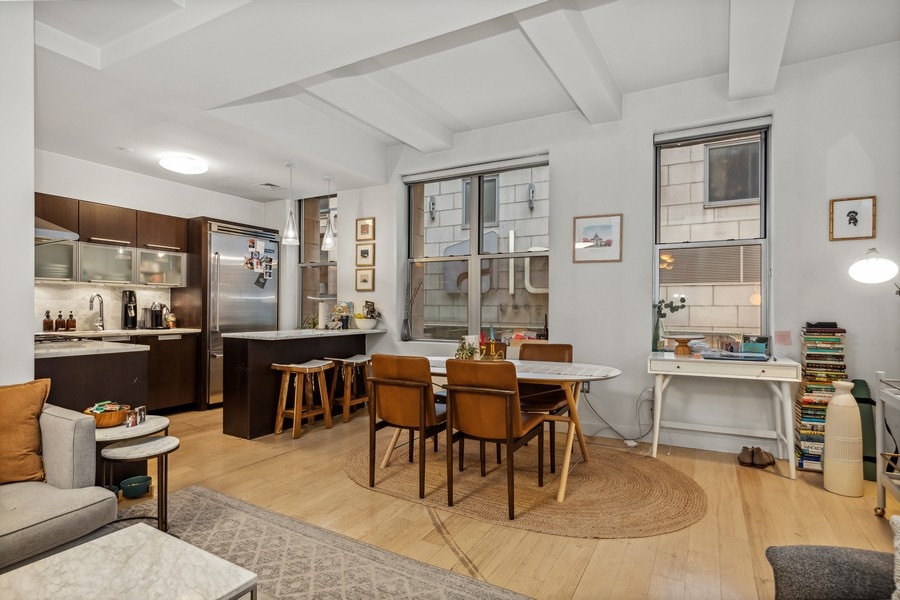 119 Fulton Street, Unit 2B Manhattan, NY 10038 - Photo 3 of 10 a view of a dining room with furniture