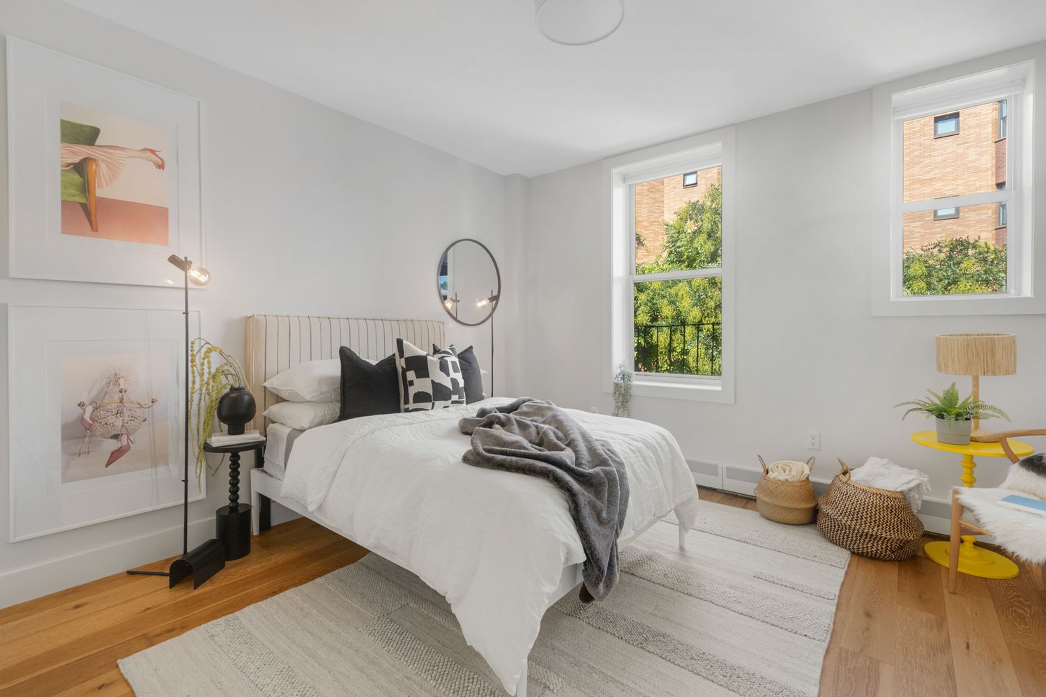 249 Hull Street, Unit C Brooklyn, NY 11233 - Photo 10 of 14 a bedroom with a bed and wooden floor