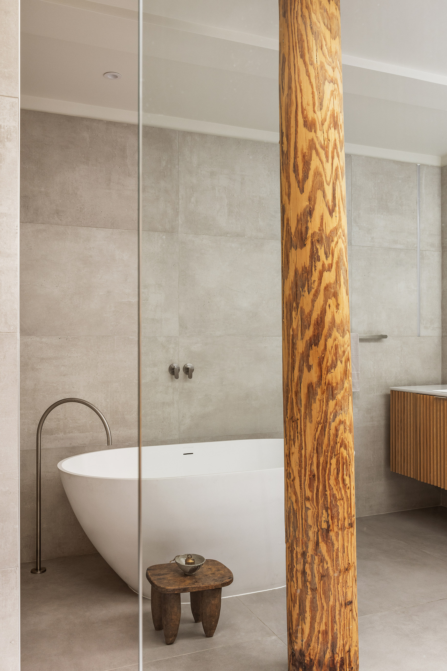 477 Broome Street Manhattan, NY 10013 - Photo 10 of 18 a bathroom with a bathtub and shower