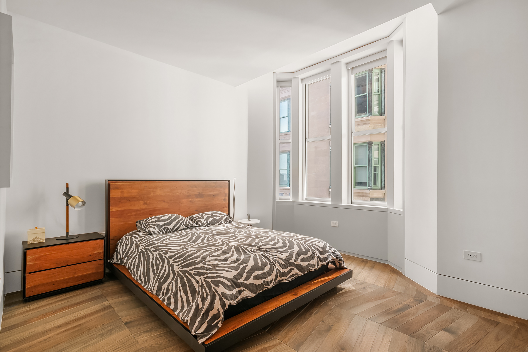 49 Chambers Street, Unit 15B Manhattan, NY 10007 - Photo 8 of 20 a bedroom with a bed and a window