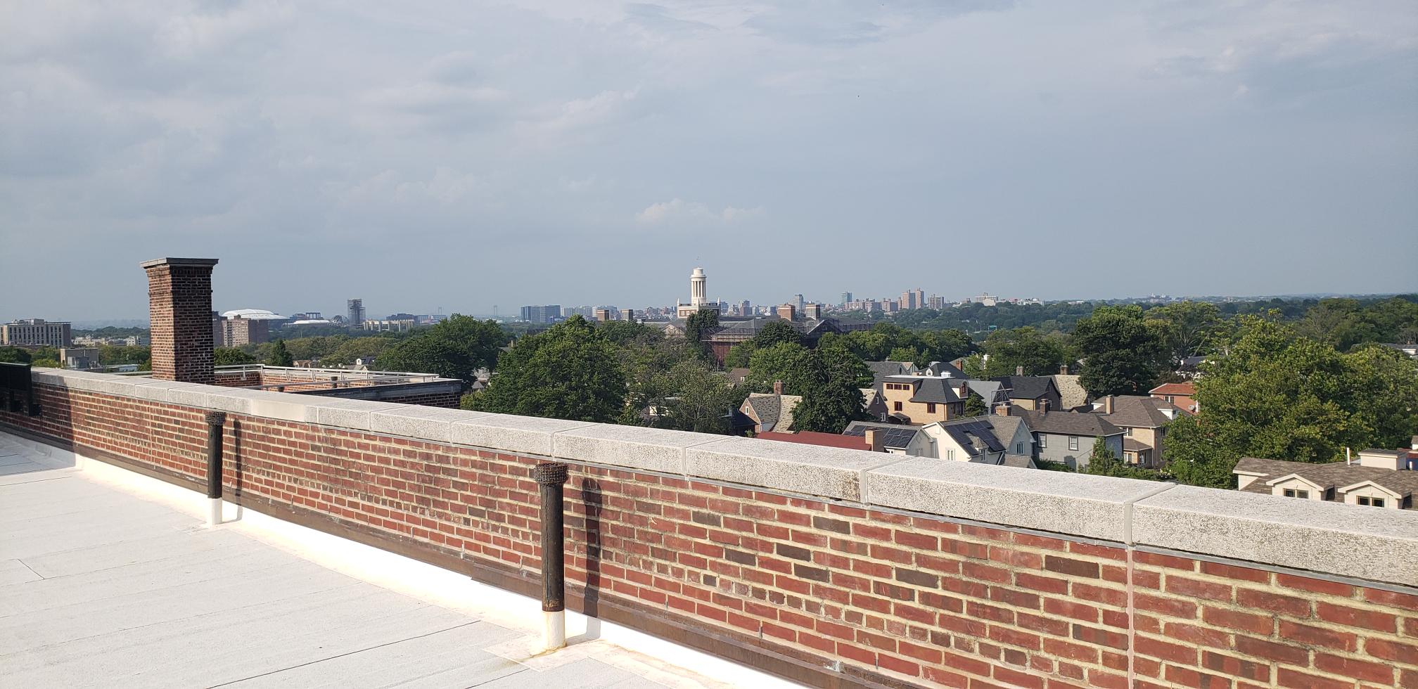 68-10 108th Street, Unit 6D Queens, NY 11375 - Photo 14 of 15 a view of a terrace with a bench