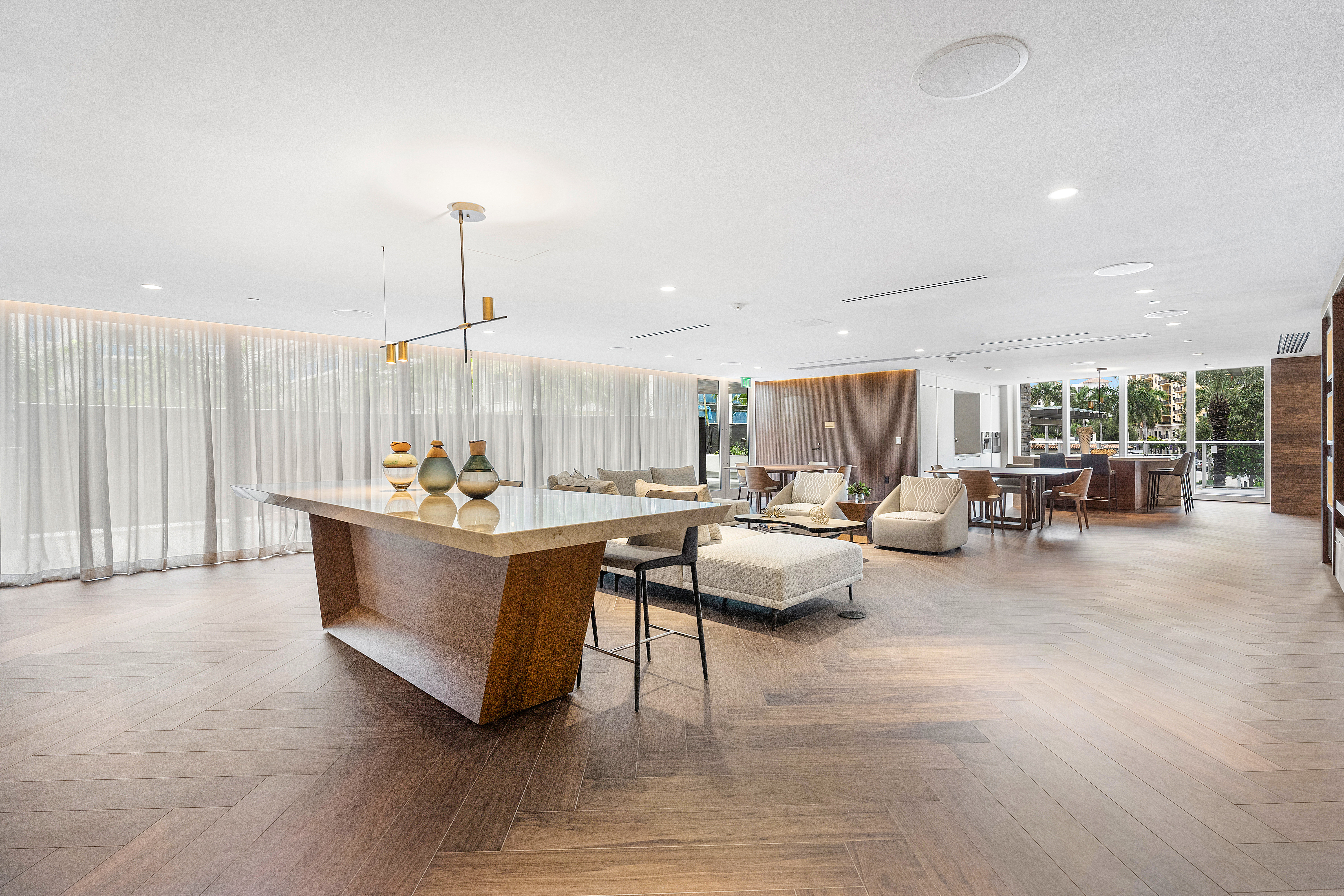 210 Southeast Mizner Boulevard, Unit 101 Boca Raton, FL 33432 - Photo 15 of 31 a living room with furniture and a wooden floor