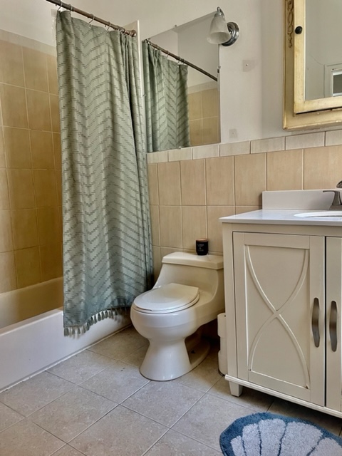 210 East 60th Street, Unit 4 Manhattan, NY 10022 - Photo 8 of 8 a bathroom with a toilet and a sink