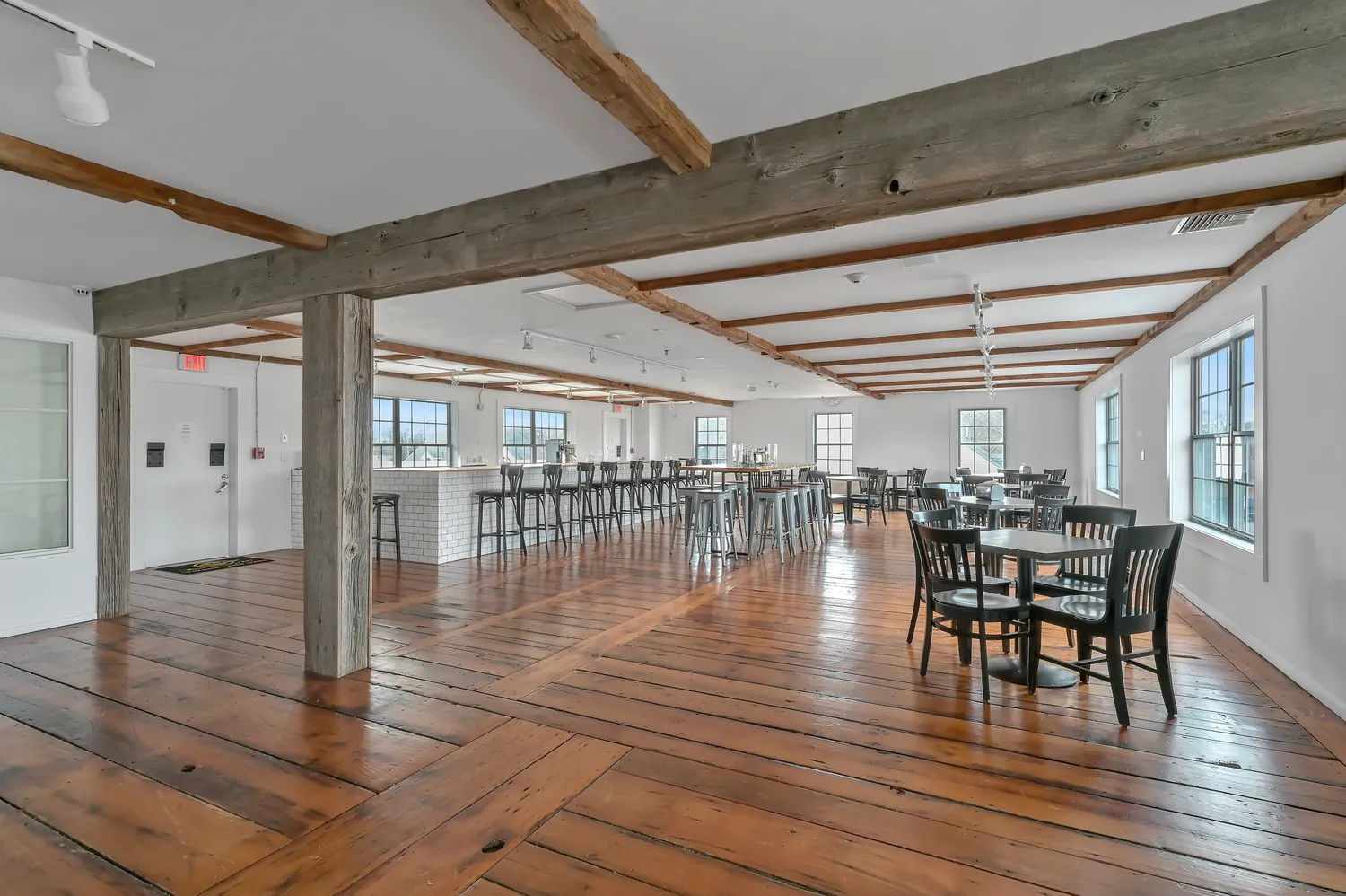 a dining room with furniture wooden floor and chandelier