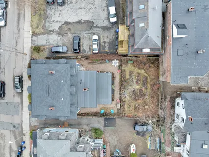 an aerial view of residential house with outdoor space