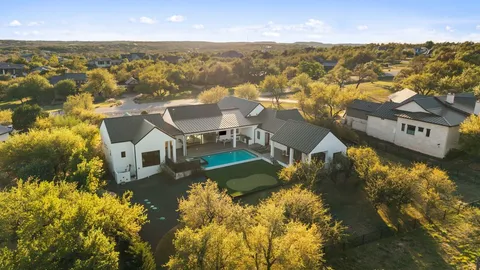 a view of house with outdoor space and sitting area