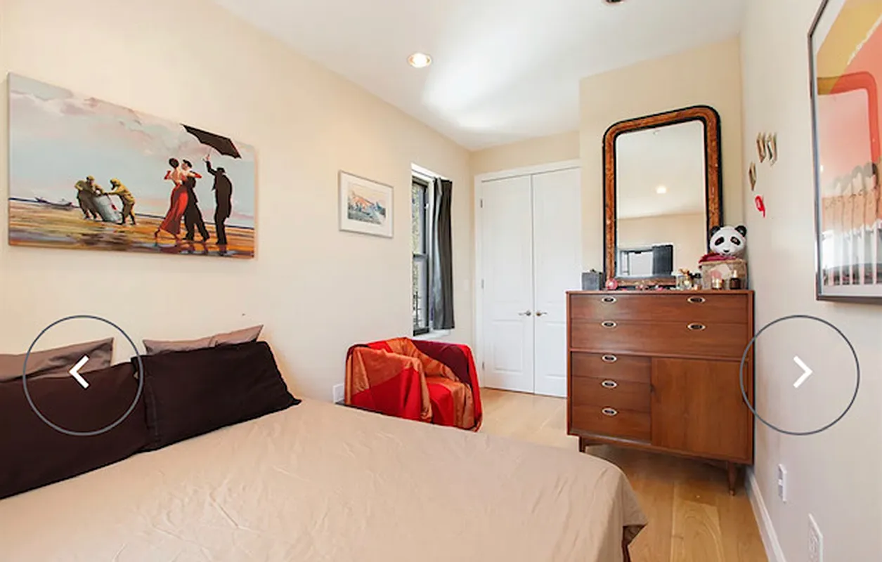 230 Frost Street Brooklyn, NY 11211 - Photo 6 of 17 a bedroom with a bed and dresser with mirror