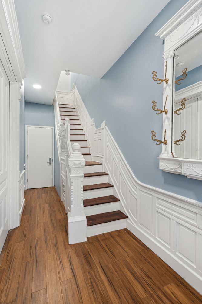 692 Putnam Avenue, Unit 2 Brooklyn, NY 11221 - Photo 13 of 15 a view of a hallway with wooden floor and staircase