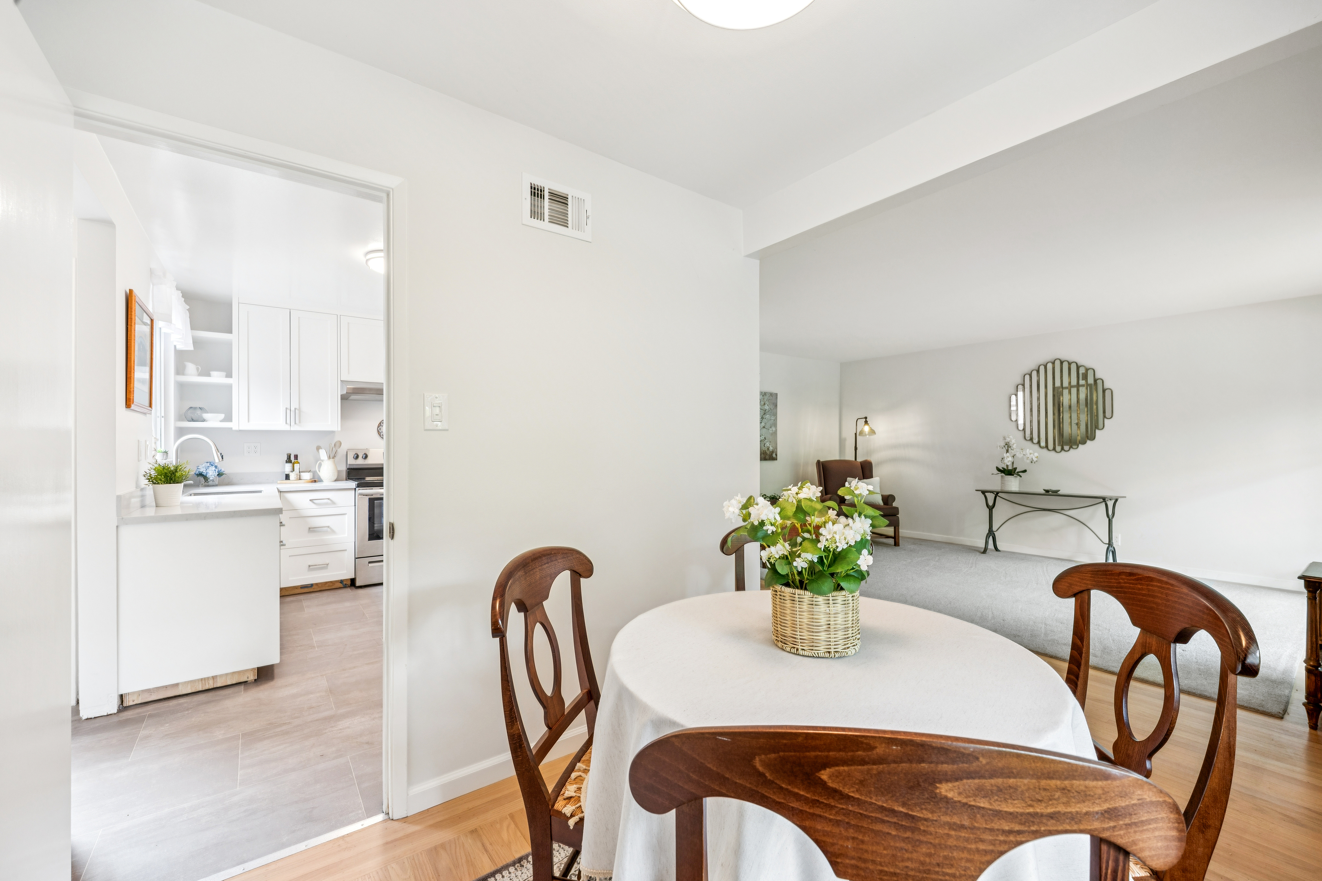 77 Bothin Road Fairfax, CA 94930 - Photo 5 of 32 a dining room with furniture and potted plants