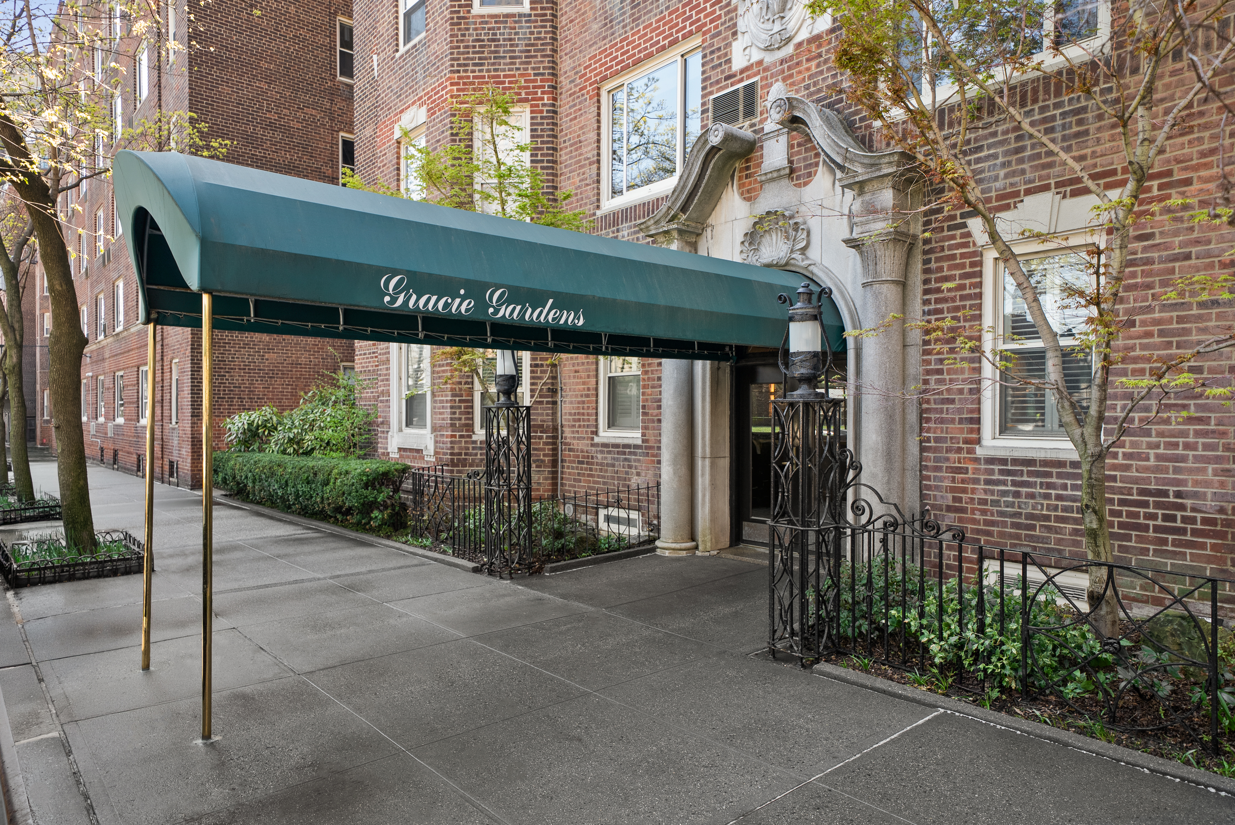 530 East 90th Street, Unit 2M Manhattan, NY 10128 - Photo 10 of 12 a front view of a building with garden