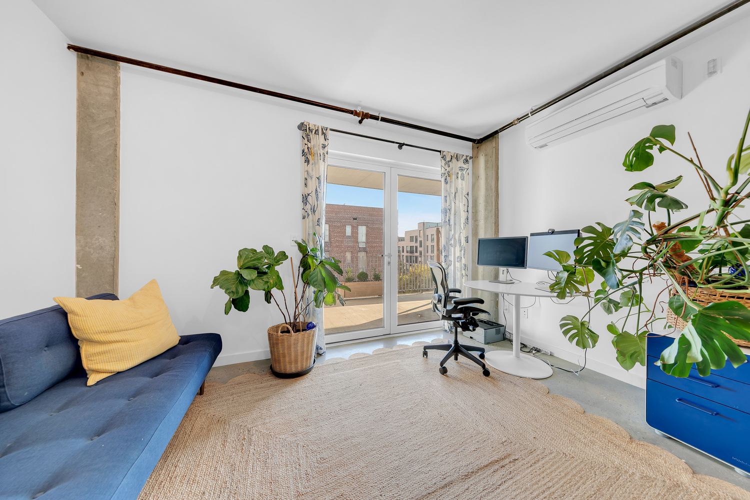 651 New York Avenue, Unit 604 Brooklyn, NY 11203 - Photo 8 of 13 a view of a workspace with furniture and a potted plant