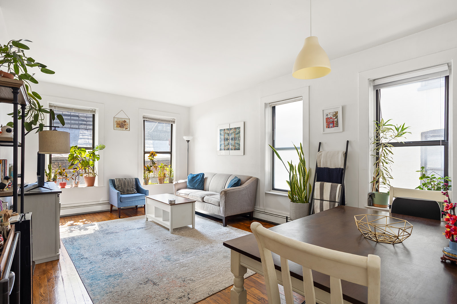 126 Sterling Place, Unit 2C Brooklyn, NY 11217 - Photo 1 of 8 a living room with furniture and wooden floor