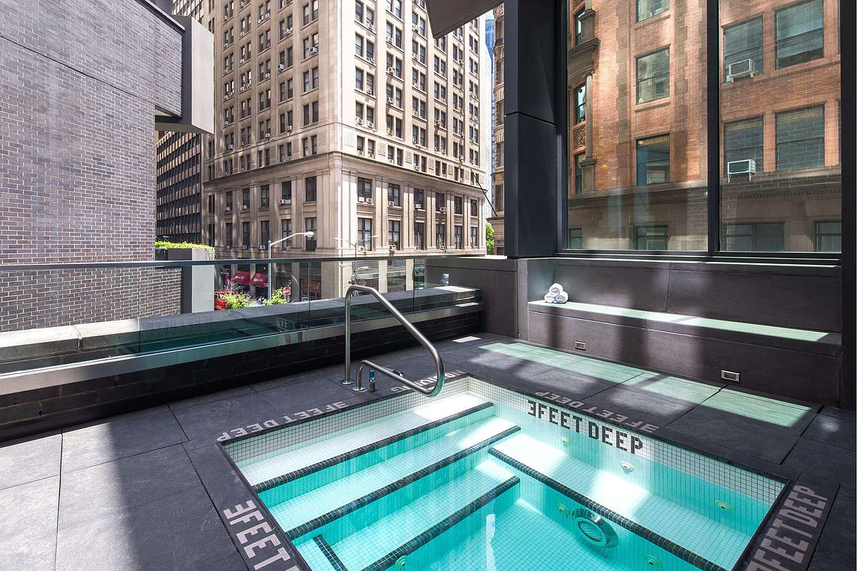 15 William Street, Unit 40C Manhattan, NY 10005 - Photo 12 of 18 a view of a building from a balcony