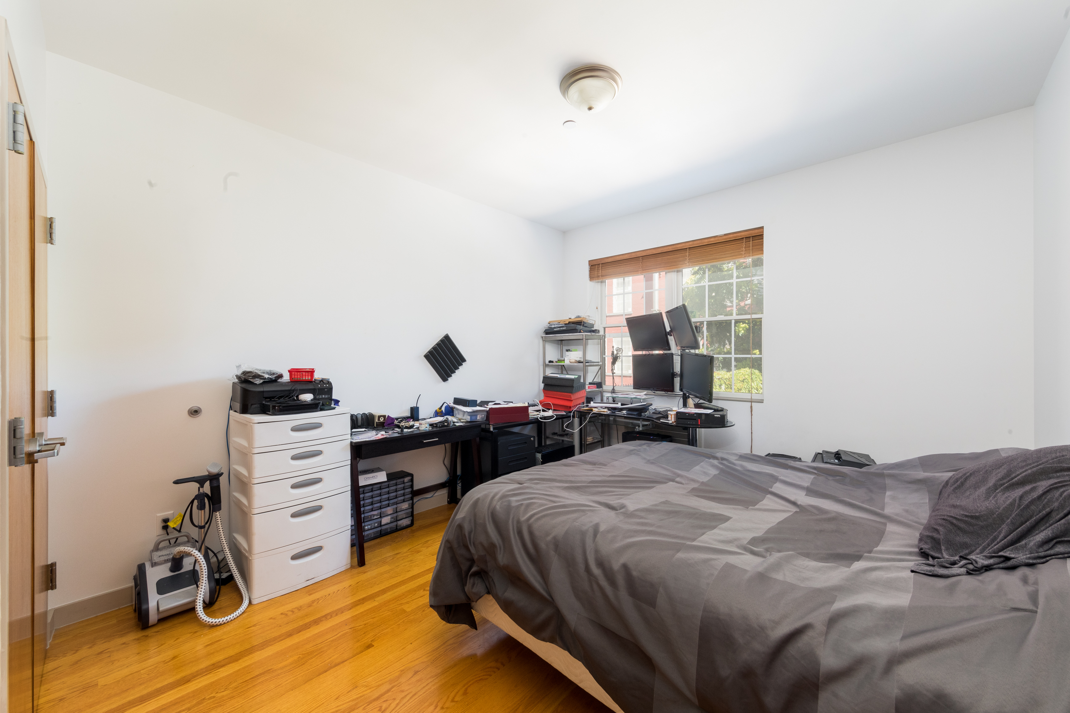 713 Metropolitan Avenue, Unit 2R Brooklyn, NY 11211 - Photo 3 of 5 a bed sitting in a bedroom next to a window