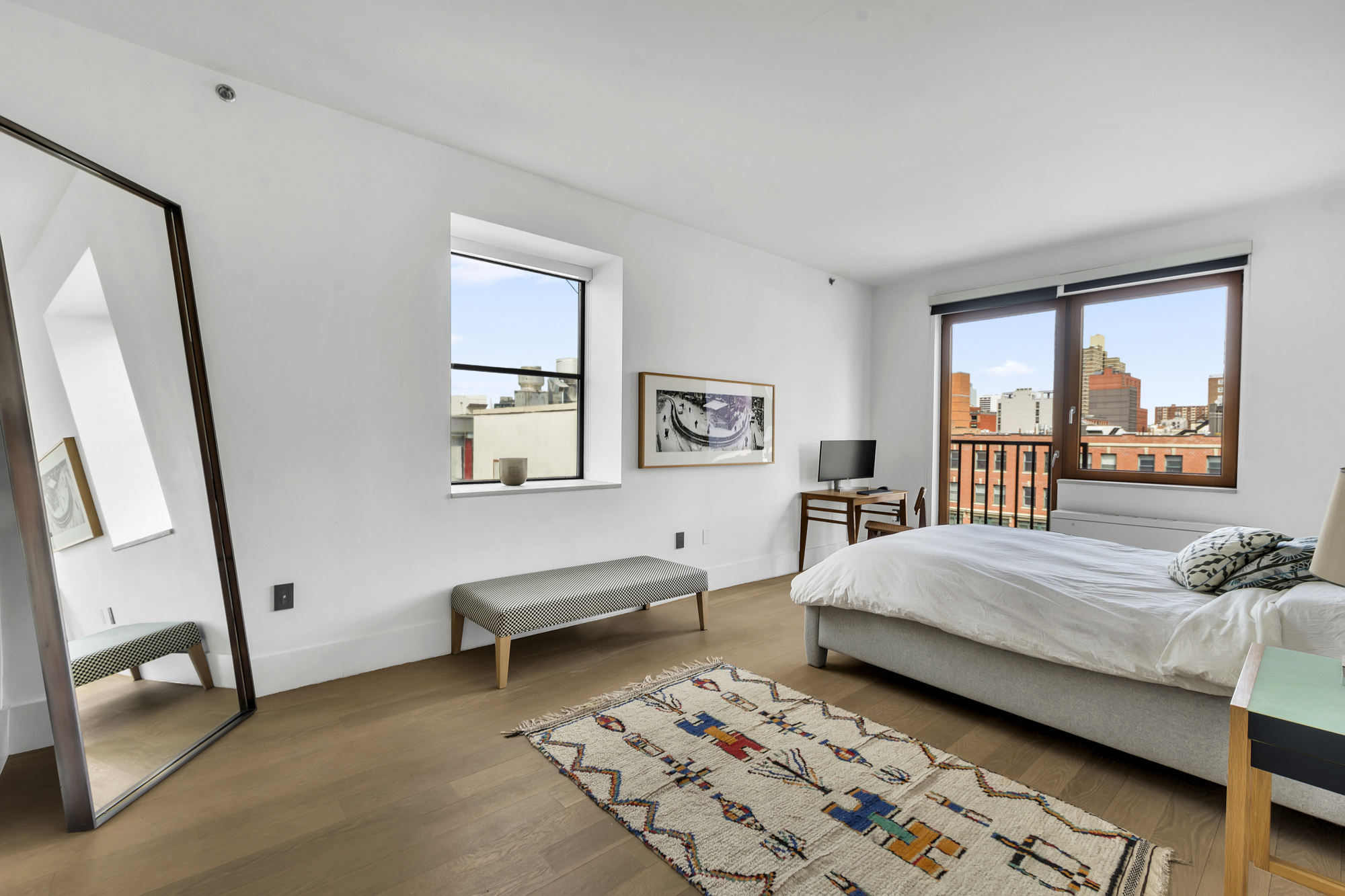 267 West 124th Street, Unit 6A Manhattan, NY 10027 - Photo 14 of 24 a bedroom with a bed and a window
