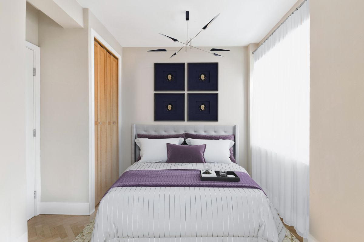 80 Park Avenue, Unit 9L Manhattan, NY 10016 - Photo 4 of 10 a bedroom with a bed and a window
