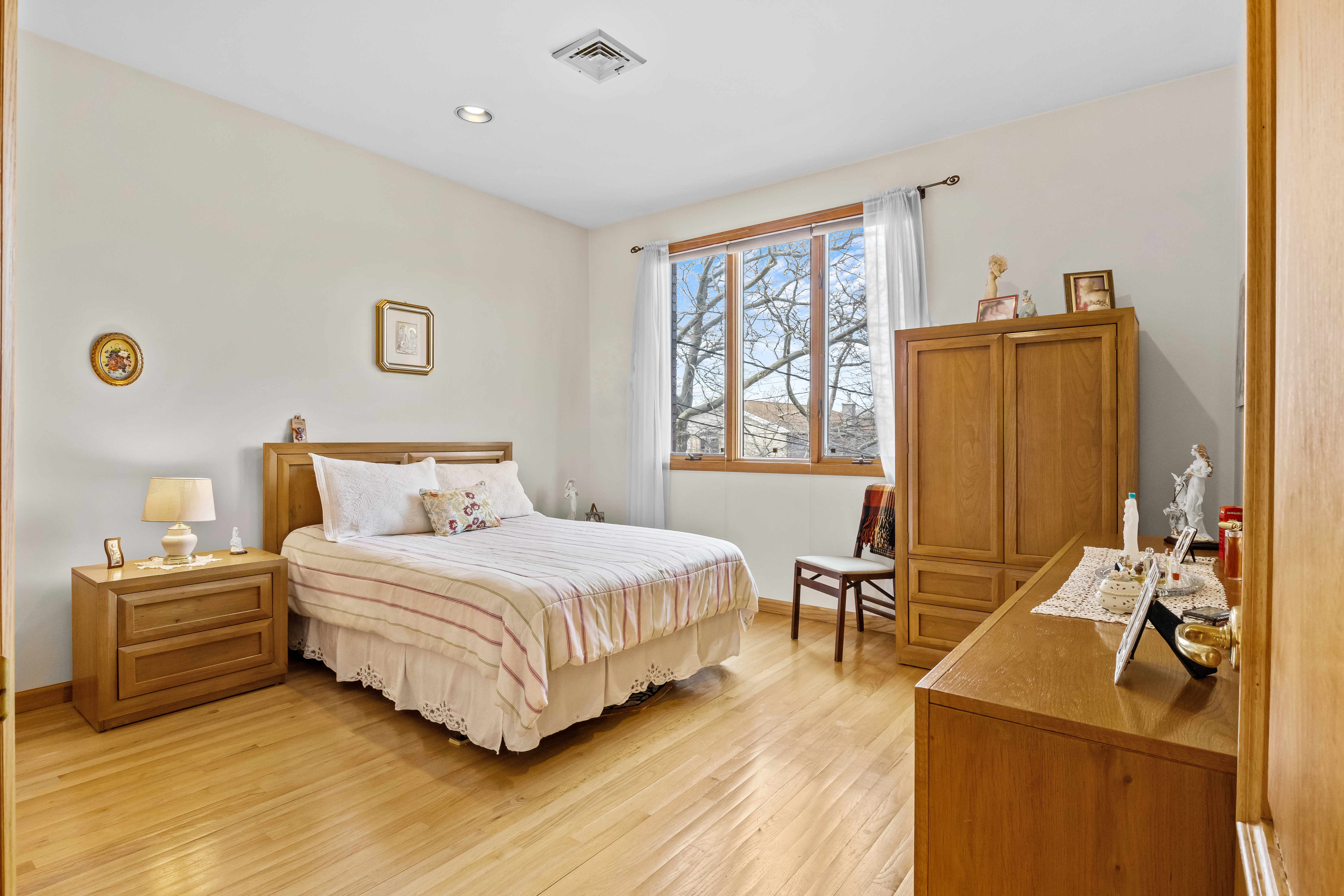 303 Whitman Drive Brooklyn, NY 11234 - Photo 24 of 37 a bedroom with a bed and wooden floor