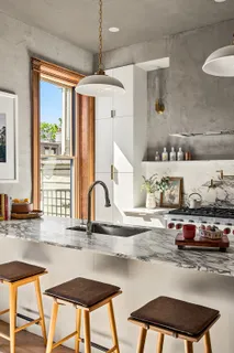 a kitchen with a table and chairs in it