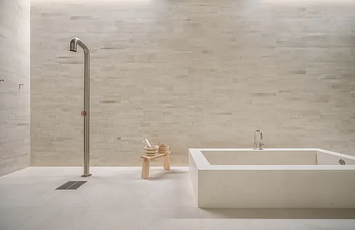 67-69 Franklin Street, Unit 2B Manhattan, NY 10013 - Photo 14 of 16 a white bath tub sitting in a bathroom and mirror