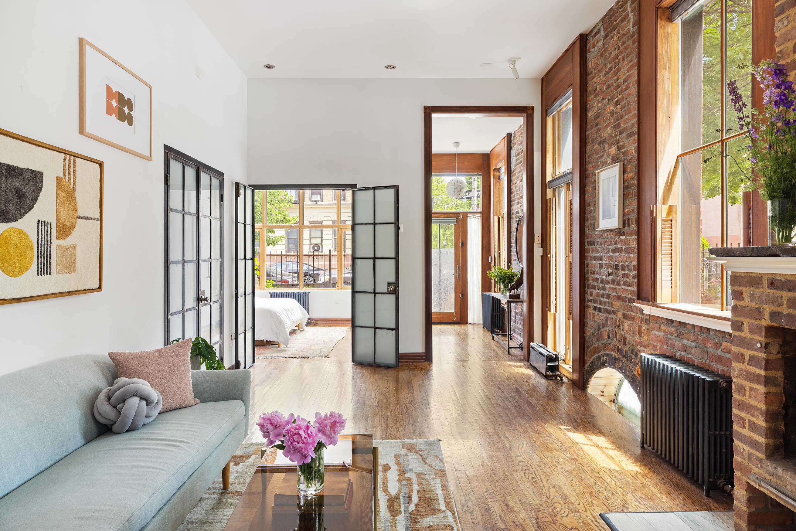 412 Classon Avenue Brooklyn, NY 11238 - Photo 2 of 30 a living room with furniture and floor to ceiling windows
